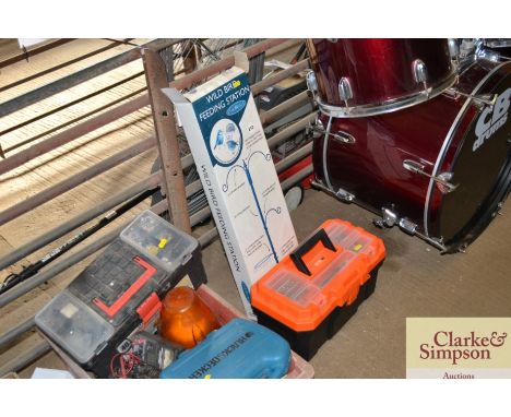 A plastic toolbox and contents of various tools and a wild bird feeding station