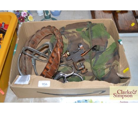 A vintage cartridge belt, cartridge loading tool, a pair of horse stirrup, horse bit, camouflage bag etc. 