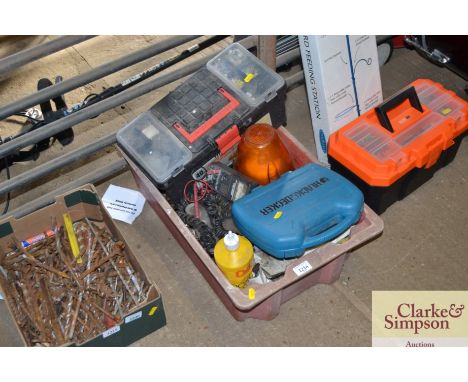 A box containing plastic toolbox, orange warning light, various fittings