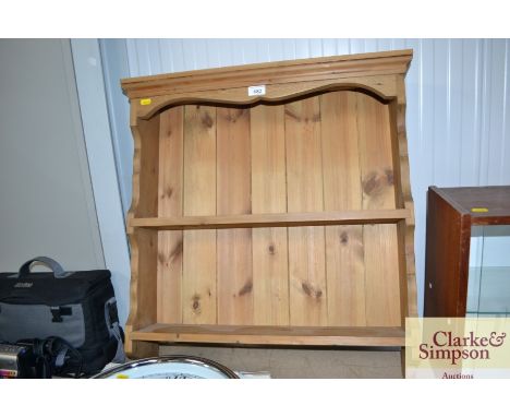 A stripped pine wall shelf
