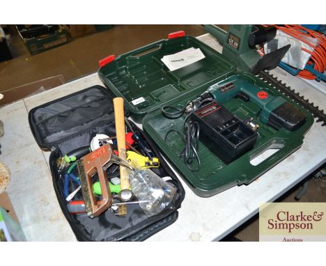 A Metabo 12 volt cordless drill in case with charger and battery together with a further tool case with a small selection of 