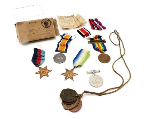 WWI pair of medals (27682 SJT D C JONES R W FUS) + 'Service wounded stripe', dog / ID tags, WWII medals etc