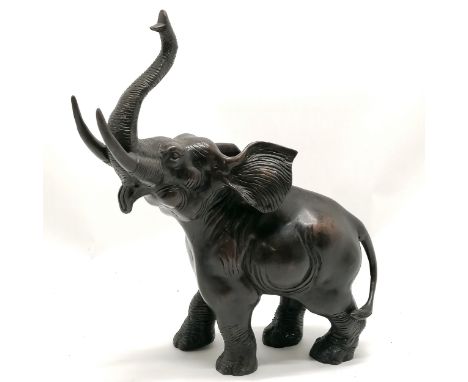 Bronze figure of an elephant with it's trunk raised 32.5cm high x 26cm long - no obvious damage