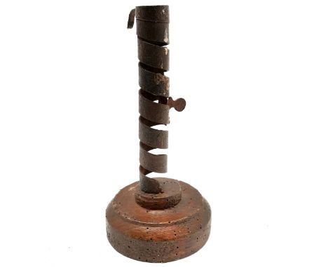 Antique wrought iron pig tailed / courting candlestick on turned wooden base - 20.5cm high and has old worm to wood