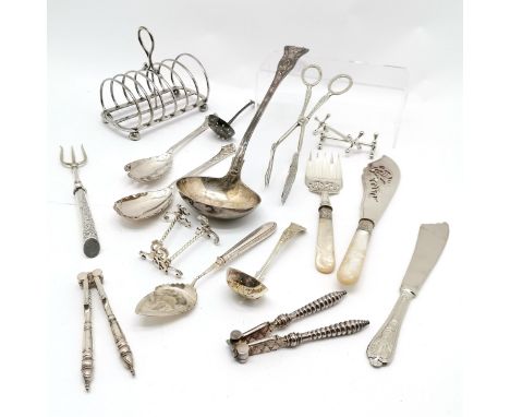 Qty of silver plate inc toastrack, knife rests, bread fork, large kings pattern ladle (35cm long), servers etc