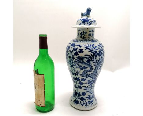 Antique Chinese Kangxi blue &amp; white vase with dragon decoration and fo dog finial to lid and has 4 character mark to base