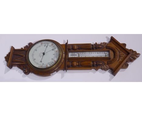 Early 20th century carved oak cased aneroid barometer with mercury thermometer, signed 'John Dyson, Leeds', H90cm Condition R
