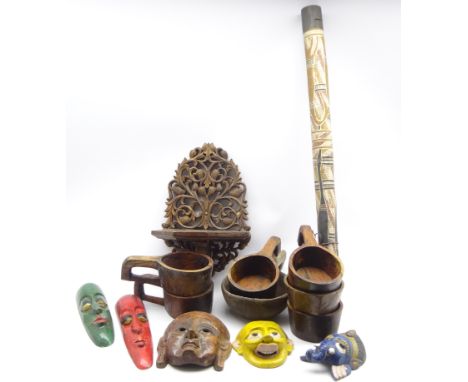Five carved and painted Eastern face masks, carved wall bracket, didgeridoo, hardwood serving bowls  Condition Report & Furth
