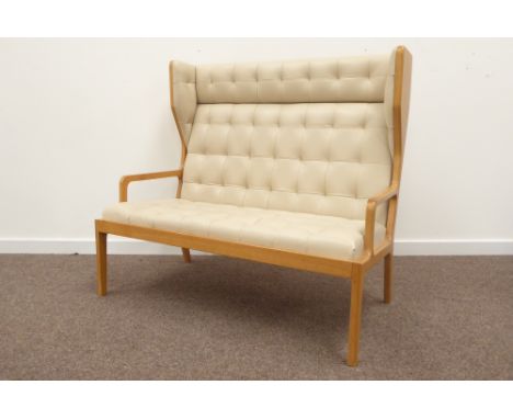 Contemporary light oak framed two seat wing back hall settee, upholstered in quilted beige leather, open arm rests, square ta