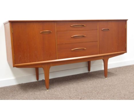 Mid 20th century retro teak side board, rectangular top above three graduating drawers, cupboard to each end enclosing single