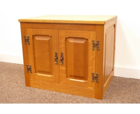 'Knightman' Yorkshire oak low cupboard, two fielded paneled doors enclosing one adjustable shelf, with carved knight signatur
