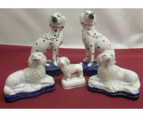 Pair of small Staffordshire Spaniels, another pair with black spotted markings, gilt collars and chains, H13cm, all on blue g