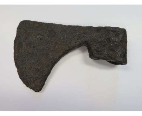 FOUR EASTERN EUROPEAN AXE-HEADS, 11TH TO 13TH CENTURIES the first two of Kirpichnikov's type IV with moderately broad blades 
