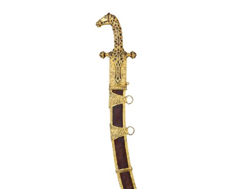 ‡AN INDIAN SWORD (SHAMSHIR), LATE 19TH CENTURY, PROBABLY KUTCH with curved single-edged blade (areas of pitting), gilt copper