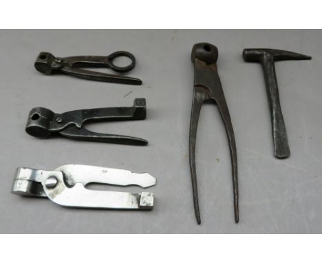 ‡FOUR VARIOUS BULLET MOULDS AND A FLINT KNAPPER, LATE 18TH/EARLY 19TH CENTURIES the first for 20 bore ball, with a spru-cutte