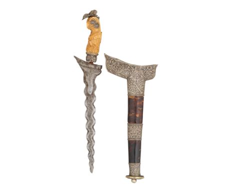 ‡˜AN INDONESIAN DAGGER (KRIS), 19TH CENTURY with wavy blade formed with a reinforced panel on each face at the forte, carved 