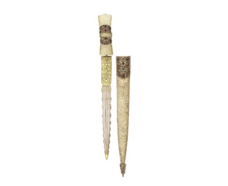 ‡AN INDIAN JADE-HILTED DAGGER, LATE 19TH CENTURY with straight blade formed with a central fuller, wavy edges, decorated with