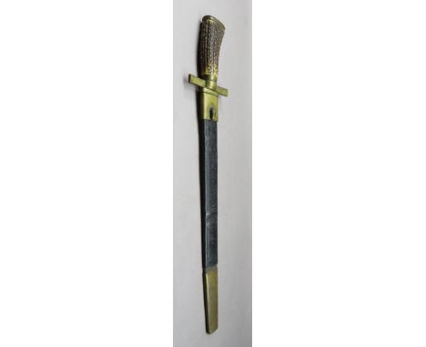 ‡A GERMAN HUNTING SWORD, 19TH CENTURY with broad blade formed with a long slender fuller on each face, brass hilt comprising 