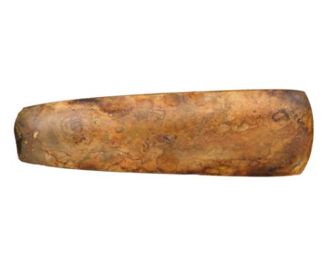 A LARGE NEOLITHIC PERIOD AXE, SCANDINAVIAN, CIRCA 2500 BC of amber colour and polished on all sides 26.5 cm; 10 1/2 in
