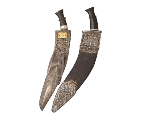 TWO NEPALESE SILVER-MOUNTED DAGGERS (KUKRI), LATE 19TH/EARLY 20TH CENTURY the first with angular single-edged blade, silver-m