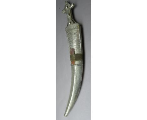 AN ARAB DAGGER (JAMBIYA), WAHABI, LATE 19TH/20TH CENTURY with broad curved double-edged blade formed with two long fullers an