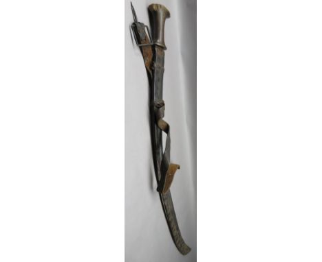 ˜AN ETHIOPIAN SWORD (SHOTEL) WITH RHINOCEROS HORN HILT, EARLY 20TH CENTURY with curved blade, etched with trophies, foliage a