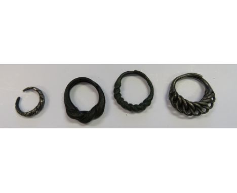 TEN PLAITED SILVER AND BRONZE FINGER RINGS, BALTIC, 11TH TO 13TH CENTURY AND SEVEN OTHER RINGS four of silver (one with latti