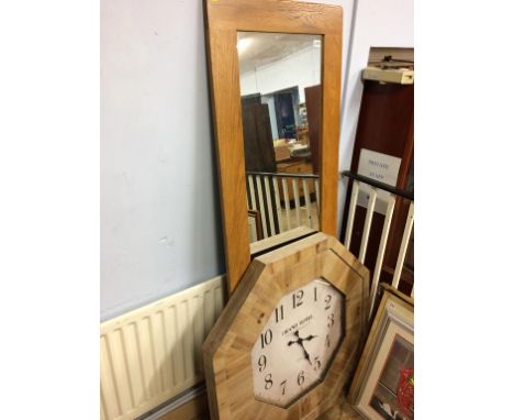 An oak framed mirror and a large clock