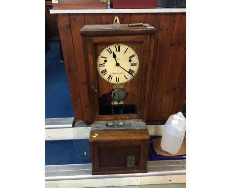 An oak Clocking in Clock
