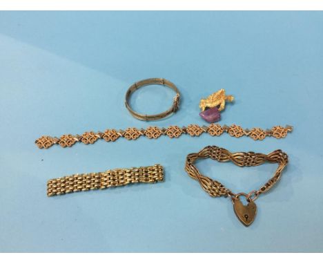 A yellow metal gate bracelet and a quantity of yellow metal jewellery