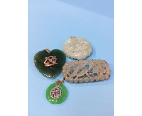 A collection of jade brooches