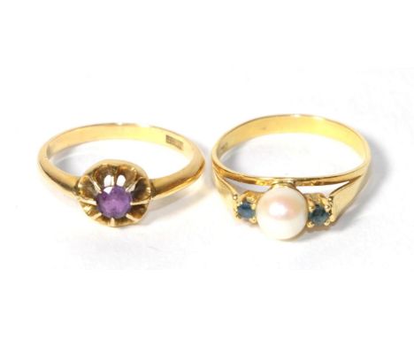 An amethyst ring, finger size P; and a cultured pearl and sapphire three stone ring, stamped '750', finger size R (2).  Ameth