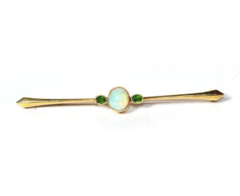 An opal and peridot bar brooch, stamped '15CT'.  Gross weight 3.6 grams 