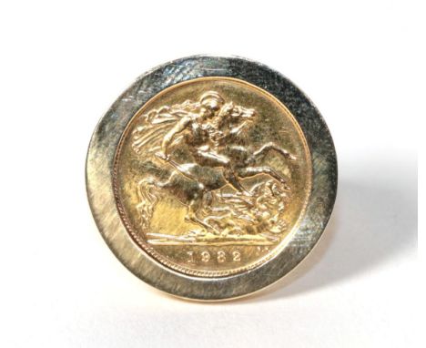 A 9 carat gold 1982 half sovereign ring, finger size R.  Gross weight 11.5 grams 