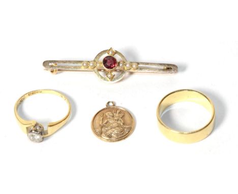 An 18 carat gold band ring, finger size L; an 18 carat gold solitaire diamond ring, finger size K; a 9 carat gold St Christop