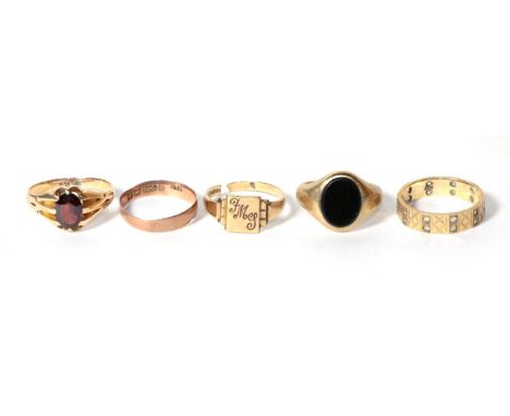 A garnet ring, stamped '15C', finger size R; a 9 carat gold band ring, finger size N1/2; a 9 carat gold hardstone set ring, f