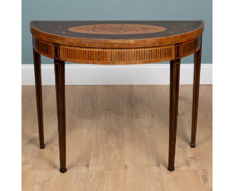 A Georgian mahogany demi-lune card table With inlaid floral decoration to the top with a kingwood crossbanded border opening 