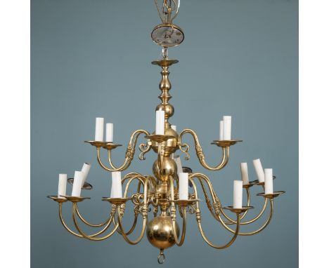A brass eighteen-branch chandelier The branches divided into two tiers of six and twelve, on a bulbous support. 95cm high (ex
