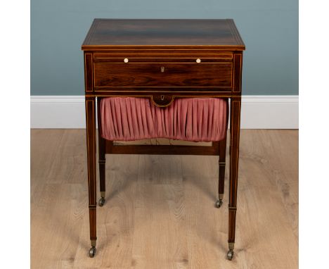A Regency rosewood sewing table With boxwood string-banded decoration, a sliding front above a drawer and a slide-out wool ba