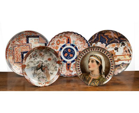 Four late 19th century Imari chargers and another The smallest with pheasant decoration, 37cm diameter; the second with a lob