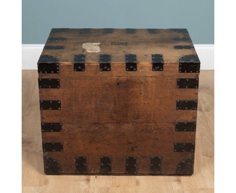A 19th century iron-bound oak chest With a brass inset plaque to the top reading 'M.C. and E. Smith Rippon', and iron carry h
