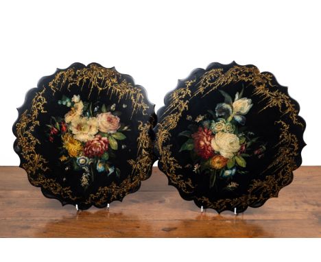 A pair of papier-mâché panels by Jennens & Bettridge With shaped rims and a chinoiserie border centred around floral sprays. 