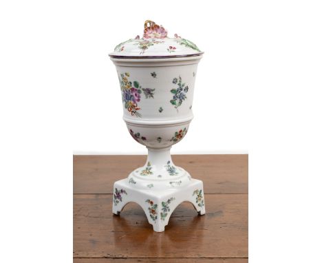 A Mennecy porcelain vase and cover The vase mounted on a plinth base and decorated with sprays of flowers, unmarked.9.5cm dia