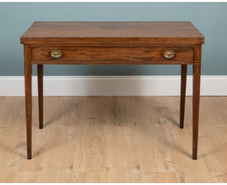 A late 19th/early 20th century mahogany fold-over side table With a single frieze drawer and raised on tapered square section