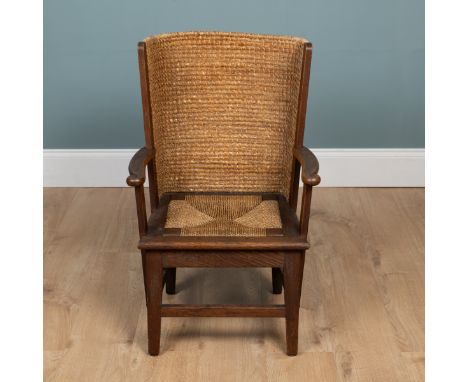 A 20th century oak-framed Orkney chair With scrolling embellishment to the arms.53cm x 82cmQty: 1In generally good condition.