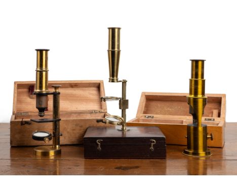 A 19th century student's microscope With a mahogany case and stand, together with two further student's small microscopes.Qty