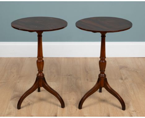 A near pair of Regency-style mahogany wine tables The circular tops on baluster supports with tripod legs.40cm diameter x 64c