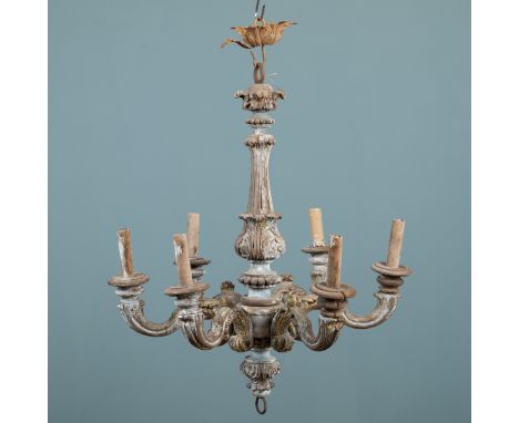 An 18th/19th century Continental carved fruitwood chandelier converted for electricity The chandelier with carved scrollwork 