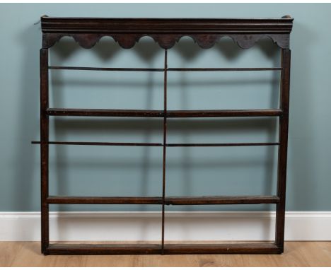 An 18th century oak and elm Delft rack With three shelves.128cm wide x 17cm deep x 126cm highQty: 1Repair throughout. The mid