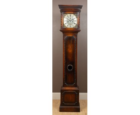 A Gillett & Johnston eight-day quarter-chiming regulator longcase clock The 18th-century style oak case of simple form with b